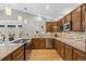 Modern kitchen with stainless steel appliances, beautiful countertops, and a cozy breakfast nook at 5410 S Vivian St, Littleton, CO 80127