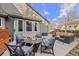 Inviting patio with an outdoor dining set, an outdoor seating area, and clear blue skies at 5410 S Vivian St, Littleton, CO 80127