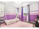 bedroom featuring white and purple striped walls, plush pink rug, and hanging swing at 3522 N Buchanan Way, Aurora, CO 80019
