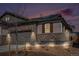 Charming single-Gathering house showcases a blend of stone and siding, complemented by a well-lit landscape at 3522 N Buchanan Way, Aurora, CO 80019