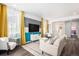 Open-concept living room with modern decor, plenty of sunlight, and seamless flow throughout the home at 3522 N Buchanan Way, Aurora, CO 80019