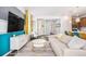 Cozy living room with modern decor, a large TV, and seamless flow to other living spaces at 3522 N Buchanan Way, Aurora, CO 80019