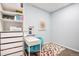 Cozy office space with a desk and colorful rug at 3522 N Buchanan Way, Aurora, CO 80019