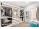 Spacious walk-in closet with custom shelving and drawers for optimal organization at 3522 N Buchanan Way, Aurora, CO 80019