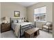 Bedroom featuring a window, full sized bed, and matching furniture at 10771 N Montane Dr, Broomfield, CO 80021