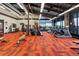 Bright fitness center featuring modern equipment, large windows, and ample workout space at 10771 N Montane Dr, Broomfield, CO 80021