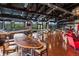 Spacious clubhouse interior showcasing stylish seating, a bar, and panoramic outdoor views at 10771 N Montane Dr, Broomfield, CO 80021