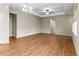 Open living room with hardwood floors, neutral color scheme, and a modern ceiling fan at 10771 N Montane Dr, Broomfield, CO 80021