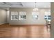 Spacious living room with hardwood floors, neutral walls, and large windows offering plenty of natural light at 10771 N Montane Dr, Broomfield, CO 80021