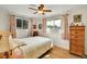 Cozy bedroom with hardwood floors, featuring natural light and tasteful decor at 5175-5185 Simms Pl, Wheat Ridge, CO 80033