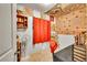 Small bedroom or bonus space featuring a desk, fan, and red curtains at 5175-5185 Simms Pl, Wheat Ridge, CO 80033