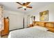 Comfortable bedroom featuring a ceiling fan, closet space, and relaxing natural light at 5175-5185 Simms Pl, Wheat Ridge, CO 80033
