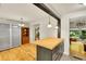 View of open floorplan featuring breakfast bar and dining area at 5175-5185 Simms Pl, Wheat Ridge, CO 80033
