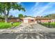 Charming brick home with a well-maintained front yard and inviting curb appeal at 5175-5185 Simms Pl, Wheat Ridge, CO 80033