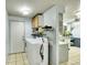 Laundry room featuring washer, dryer, and shelving at 5175-5185 Simms Pl, Wheat Ridge, CO 80033