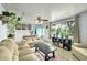 Cozy living room with large window, sofas, and vibrant rug at 5175-5185 Simms Pl, Wheat Ridge, CO 80033