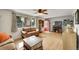 Inviting living room with hardwood floors, large windows, and comfortable seating area at 5175-5185 Simms Pl, Wheat Ridge, CO 80033