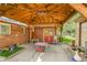 Covered patio featuring table, chairs, and backyard access at 5175-5185 Simms Pl, Wheat Ridge, CO 80033