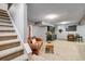 Finished basement with a comfortable seating area, wet bar, and staircase at 5300 Tabor St, Arvada, CO 80002