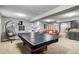 Large recreational basement with ping pong table and casual seating area at 5300 Tabor St, Arvada, CO 80002
