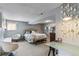 Bright bedroom featuring a sitting area and sleeping space at 5300 Tabor St, Arvada, CO 80002