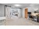 Spacious bedroom featuring sliding barn doors and a computer desk at 5300 Tabor St, Arvada, CO 80002