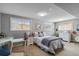 Comfortable bedroom with neutral colors and multiple windows at 5300 Tabor St, Arvada, CO 80002