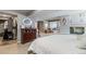 Cozy bedroom featuring a fireplace and dresser at 5300 Tabor St, Arvada, CO 80002