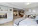 Open bedroom featuring a fireplace and space for an office at 5300 Tabor St, Arvada, CO 80002