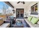 Covered porch featuring comfortable seating, a ceiling fan, and access to the home's interior at 5300 Tabor St, Arvada, CO 80002