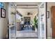 Relaxing sunroom featuring comfortable seating, plants, and a ceiling fan at 5300 Tabor St, Arvada, CO 80002