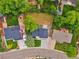 Aerial view of a home and backyard, with trees and lawn at 7684 S Ingalls St, Littleton, CO 80128