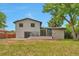 Expansive backyard with a well-maintained lawn, patio, and fresh landscaping offers a serene outdoor living space at 7684 S Ingalls St, Littleton, CO 80128