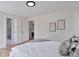 Clean bedroom showcasing two doorways and simple, understated art at 7684 S Ingalls St, Littleton, CO 80128