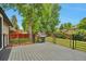 Outdoor deck features a barbecue grill and metal railings, perfect for outdoor dining and entertaining at 7684 S Ingalls St, Littleton, CO 80128