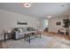 Cozy living room with hardwood floors, neutral tones, a comfortable sofa, and modern decor at 7684 S Ingalls St, Littleton, CO 80128