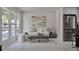 Bright living room with modern art and a cozy seating arrangement, showcasing contemporary design elements at 7684 S Ingalls St, Littleton, CO 80128