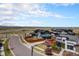 Aerial view of a modern community with well-maintained landscaping and mountain views at 9051 E 61St Ave, Denver, CO 80238