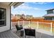 Enjoy this outdoor living area with wicker seating, a fire pit, and a spacious fenced yard at 9051 E 61St Ave, Denver, CO 80238