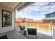 Outdoor living space featuring comfortable seating, a fire pit, and privacy fencing at 9051 E 61St Ave, Denver, CO 80238