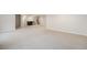 Spacious finished basement with neutral carpet and stone-accented wet bar at 9051 E 61St Ave, Denver, CO 80238