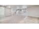 Spacious basement featuring recessed lighting, carpet and tile flooring, and multiple windows at 9051 E 61St Ave, Denver, CO 80238