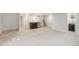 Open basement with a bar area, featuring stone accents, carpet and tile flooring at 9051 E 61St Ave, Denver, CO 80238
