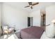Spacious bedroom with neutral tones and a comfortable seating area at 9051 E 61St Ave, Denver, CO 80238