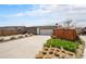 Long driveway with ample parking and a 2-car garage providing convenience and curb appeal at 9051 E 61St Ave, Denver, CO 80238