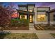 Beautiful modern home with well-maintained landscaping and attractive architectural details at 9051 E 61St Ave, Denver, CO 80238