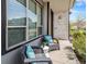 Inviting front porch with cozy seating, offering a relaxing outdoor space at 9051 E 61St Ave, Denver, CO 80238