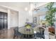Bright living room featuring high ceilings, large windows, and an open floor plan at 9051 E 61St Ave, Denver, CO 80238