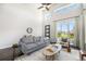 Bright living room with soaring ceilings and large windows offering ample natural light at 9051 E 61St Ave, Denver, CO 80238
