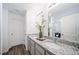 Elegant bathroom with dual sinks and granite countertops at 46559 Avery Ln, Bennett, CO 80102